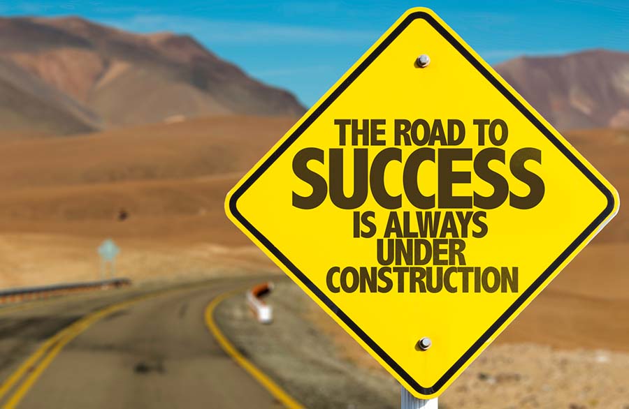 Road sign that reads "the road to success is always under construction"