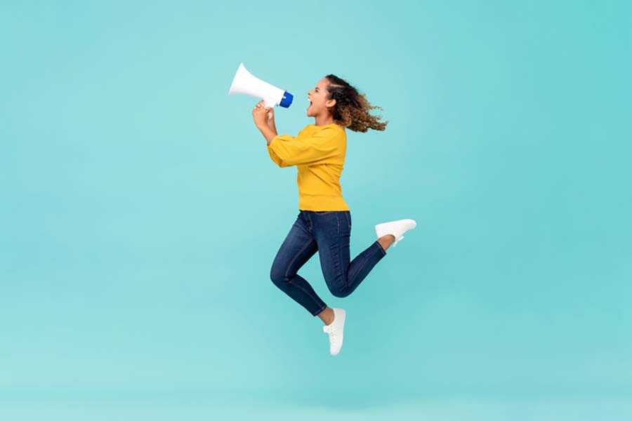 Girl with megaphone jumping