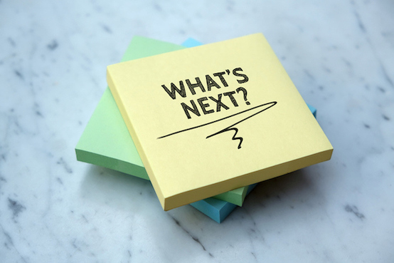 sticky notepads in blue, green, yellow with words What's Next? on the top