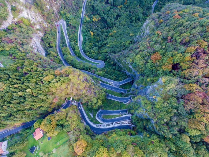 view from the sky of a windy road going in multiple directions