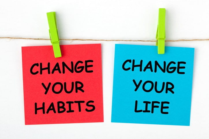signs hanging that read change your habits and change your life