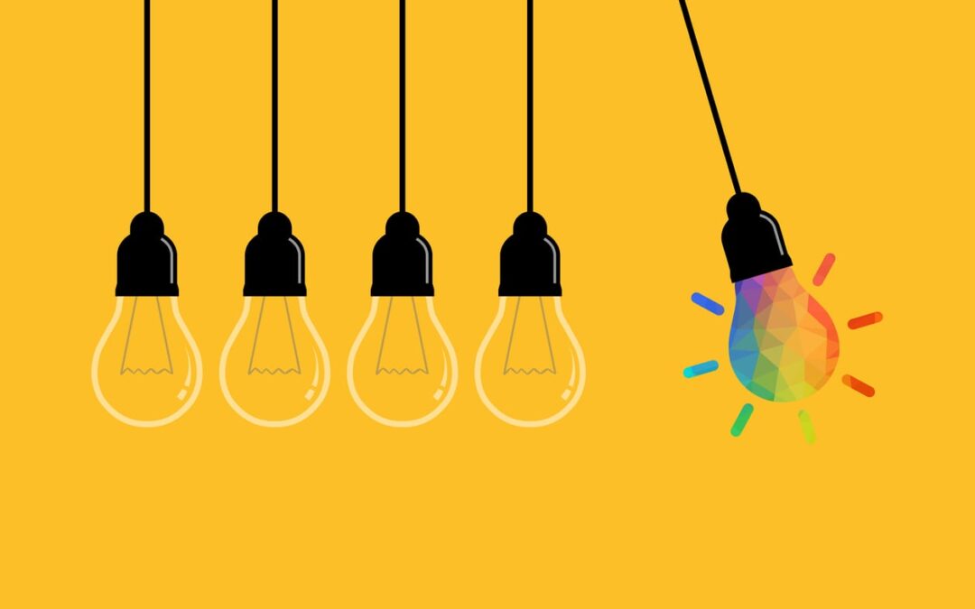 Lightbulbs on yellow background. All depicted clear except one bright rainbox light