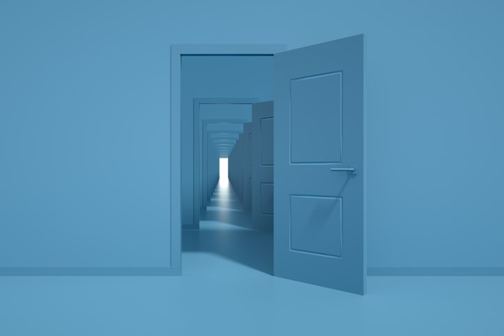 visual of all doors open seeing a light at end of a hallway. Color scheme blue.