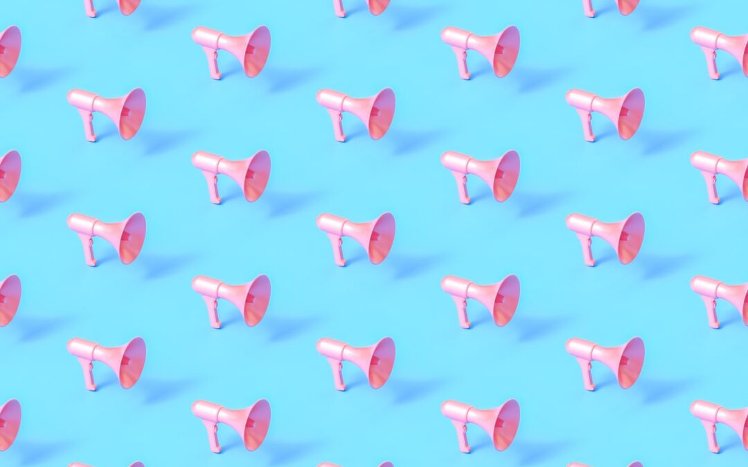 series of pink megaphones on blue background